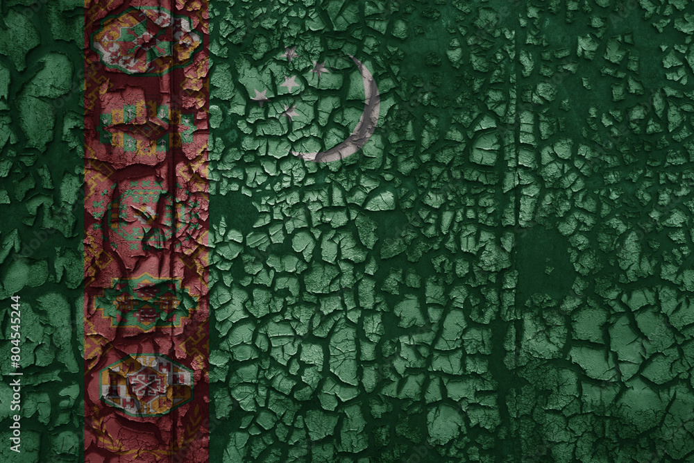 flag of turkmenistan on a old grunge metal rusty cracked wall background flag of turkmenistan on a old grunge metal rusty cracked wall background
