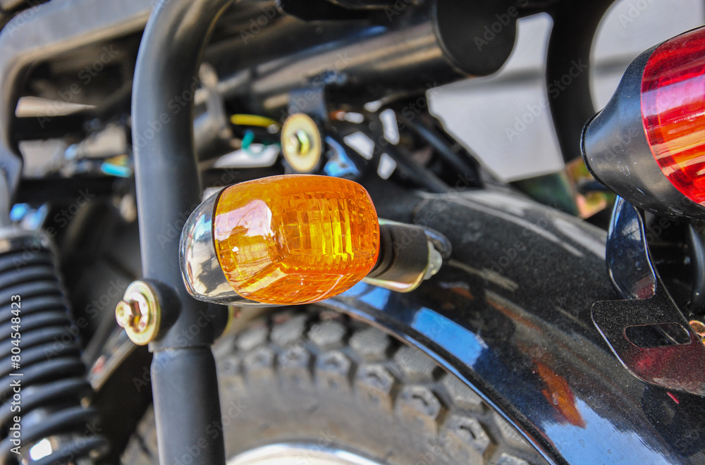 Fototapeta premium detail of a motorcycle. motorcycle turn signal close-up. blurred background