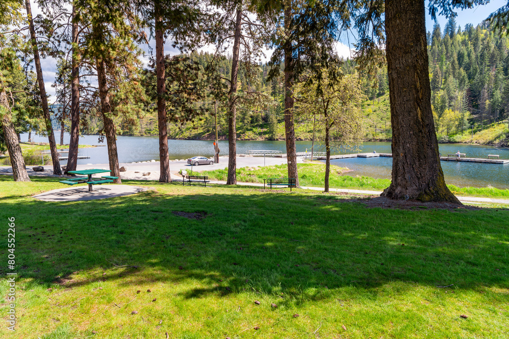 View from the small public Fernan Park and Boat Launch, a lakefront park and fishing spot along Fernan Lake in the downtown district of Coeur d'Alene, Idaho USA. View from the small public Fernan Park and Boat Launch, a lakefront park and fishing spot along Fernan Lake in the downtown district of Coeur d'Alene, Idaho USA.