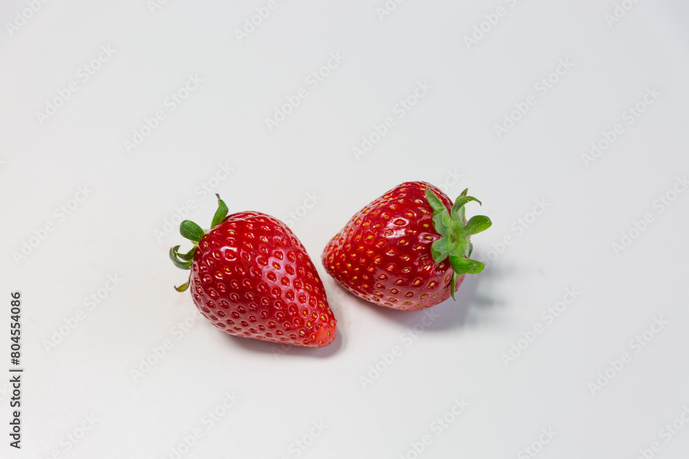 Red ripe strawberry background, close-up, front view, top view, strawberry plate with white background,