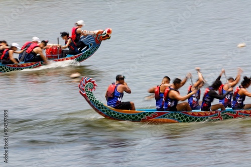 Wallpaper Mural A competitive boat racing in the Dragon Boat Festival in Taipei, Taiwan, with the athletes pulling vigorously on the oars and compete with all their strength in traditional colorful dragon boats Torontodigital.ca