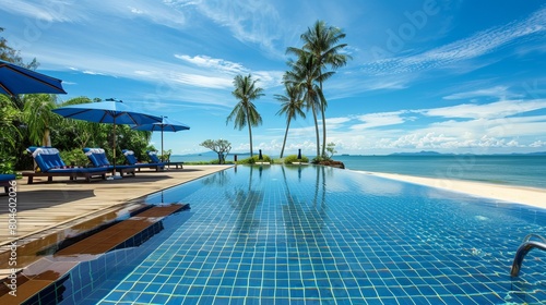 A luxurious swimming pool is positioned in front of the beach, offering a tranquil escape. © Khalida