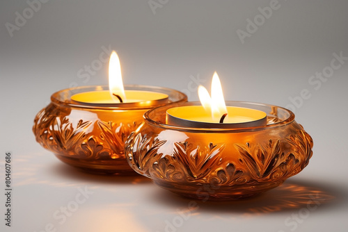 Two Diwali diya  Indian oil lamp  on white background. Indian Light Festival. Holiday design