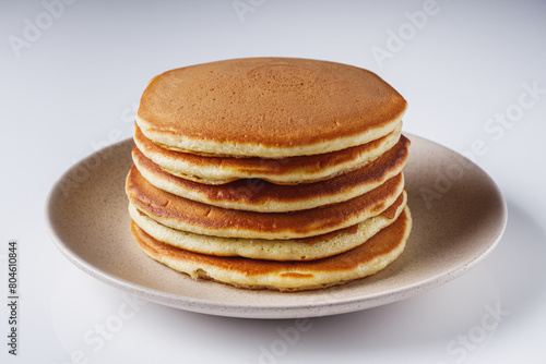 fresh tasty pancakes on a white background