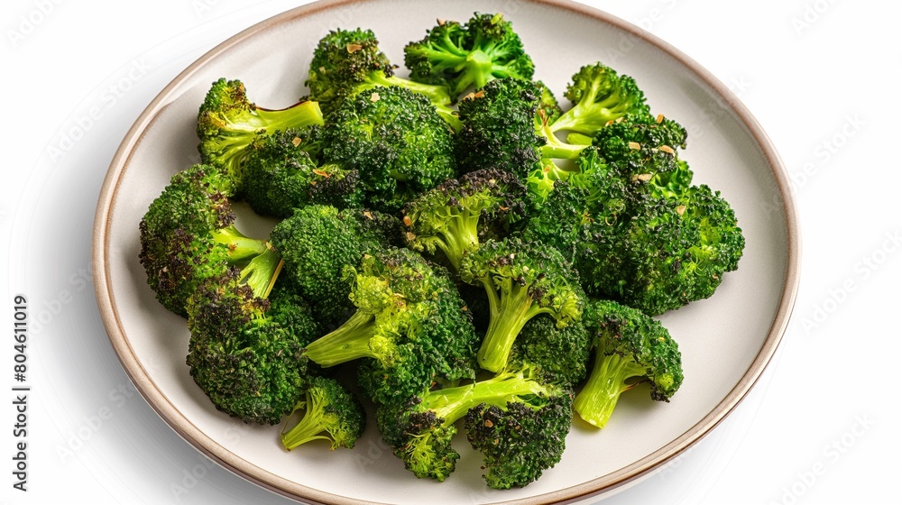 An image featuring steamed broccoli placed on a white plate against a plain background, isolated to draw focus, captured from above to showcase the arrangement, suitable for food photography. An image featuring steamed broccoli placed on a white plate against a plain background, isolated to draw focus, captured from above to showcase the arrangement, suitable for food photography.