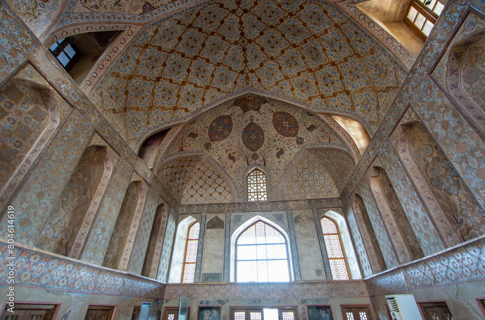 The intricate ceiling design of Ali Qapu Palace is a testament to Persian craftsmanship. This palace offers the best view of Naqsh Jahan Square in Isfahan, Iran.