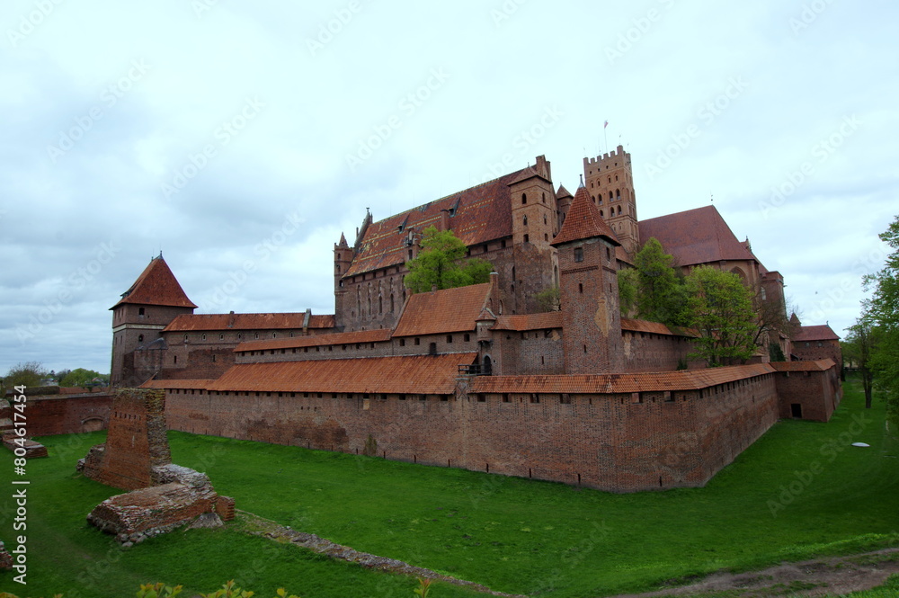 The Castle of the Teutonic Order in Malbork - Malbork Castle, Ordensburg Marienburg s a 13th-century castle complex located in the town of Malbork, Poland. The Castle of the Teutonic Order in Malbork - Malbork Castle, Ordensburg Marienburg s a 13th-century castle complex located in the town of Malbork, Poland.