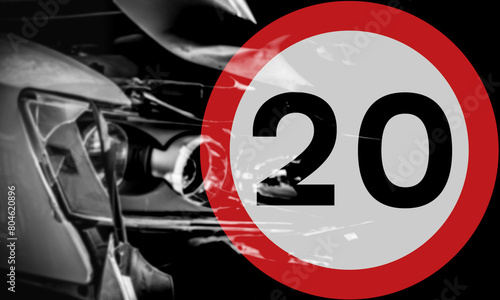 20 miles per hour speed limit A, abstract of blurred damaged vehicle and blended road speed limit sign, black and white background