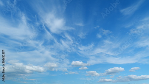 Tropical summer sunlight. Blue sky with cirrus clouds. Fluffy layered clouds sky atmosphere. Timelapse. © artifex.orlova