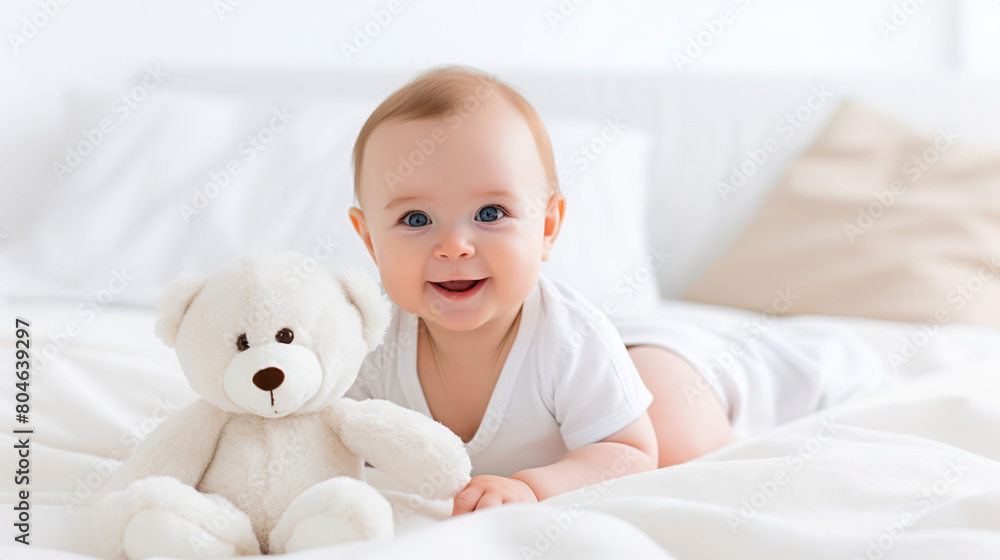 close-up 5 month old baby holds a toy in his hands lying on a white blanket in a bright room on the left, close-up 5 month old baby holds a toy in his hands lying on a white blanket in a bright room on the left,