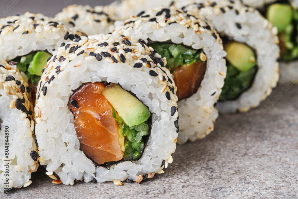 delicious fresh sushi roll with salmon cucumber and avocado delicious fresh sushi roll with salmon cucumber and avocado