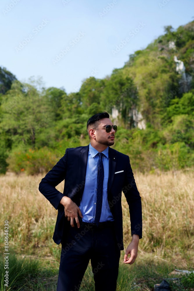 serious handsome man security guard standing for protecting his client. serious handsome man security guard standing for protecting his client.