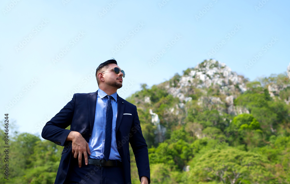 serious handsome man security guard standing for protecting his client. serious handsome man security guard standing for protecting his client.