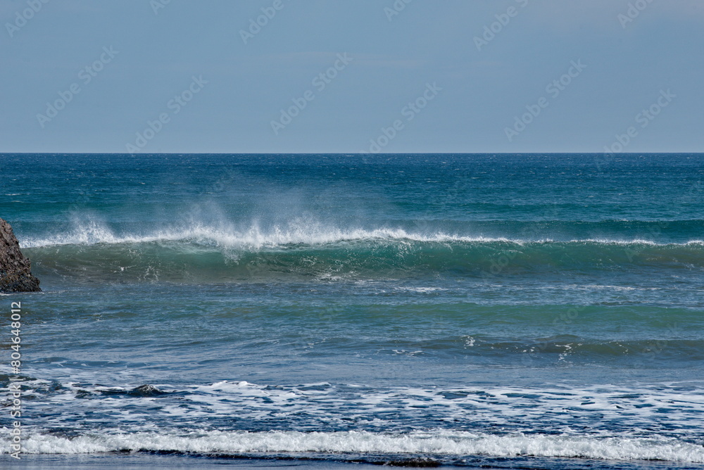 Russia. The Far East. The Kuril Islands. Storm waves coming towards the gusty wind from the shore of Iturup Island in the Sea of Okhotsk.