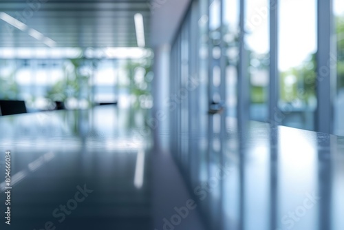 Blurry shot of a sleek conference table and chairs in a light-filled modern office space