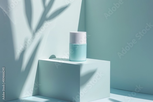 A white vase is placed on top of a white block against a light blue background with subtle shadows