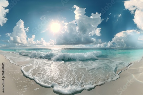 A sandy beach with white sand and rolling waves coming in from the ocean