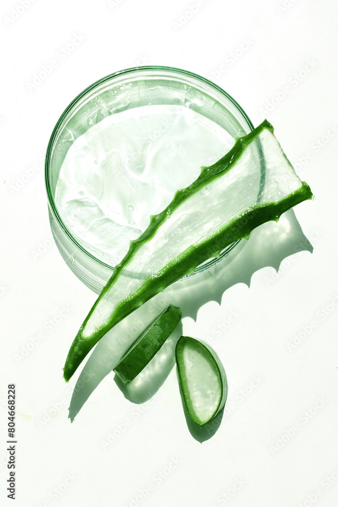 Obraz premium Aloe Vera Gel in a Glass Jar with Fresh Leaves