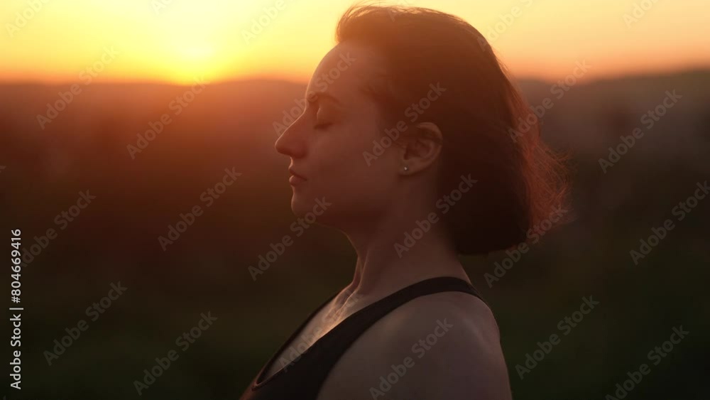Portrait of confident young woman looking ahead and exhaling fresh air taking deep breath and reducing stress after work at sunset Successful beautiful female resting for peaceful mind outdoors Portrait of confident young woman looking ahead and exhaling fresh air taking deep breath and reducing stress after work at sunset Successful beautiful female resting for peaceful mind outdoors
