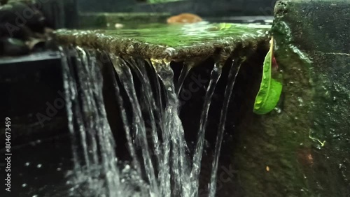 The artificial fountain in the fish pond