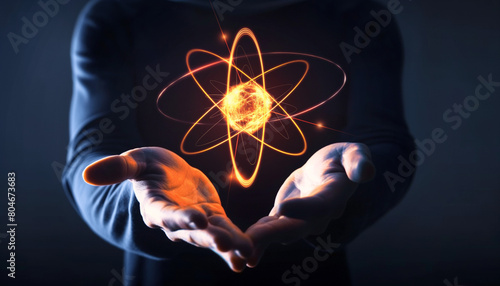 Businessman holding atom molecule as science