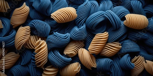 A close up of pasta with blue and yellow pieces