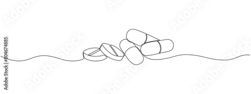 One continuous linear drawing of a scattering of tablets and capsules. Pharmaceutical drugs, medicines, vitamins, antibiotics in a simple linear style.