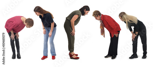 group of woman crouching looking at the ground on white background © curto
