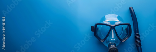 Snorkel mask web banner. Snorkel mask isolated on blue background with copy space. © Banner Brian
