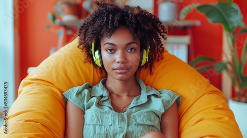 Woman Sitting in Chair With Headphones On