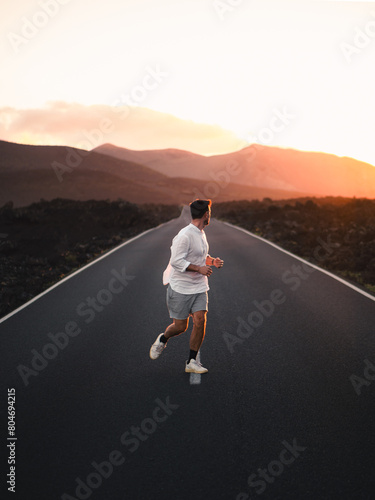 Tourist running through Timanfayas Road in Lanzarote Volcanoes photo