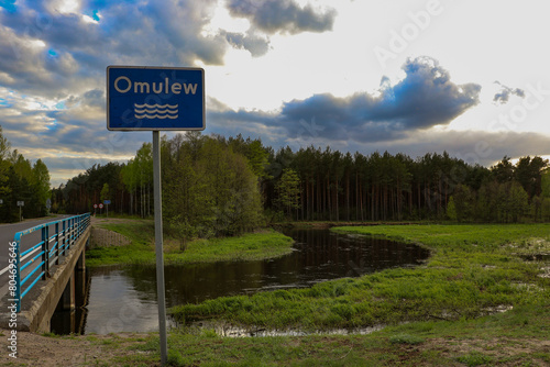 Bridge over the charming Omulew River, Masovian Voivodeship, Poland photo