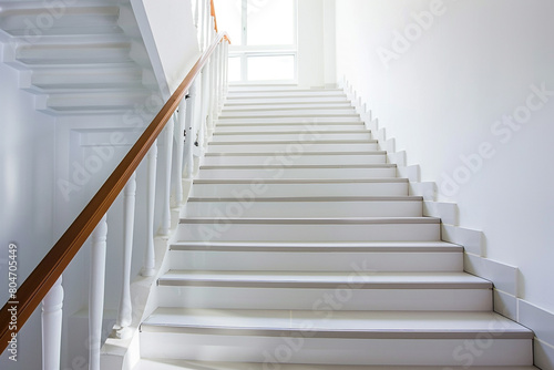 Pearl white stairs with a modern wooden handrail, pristine and elegant home design.