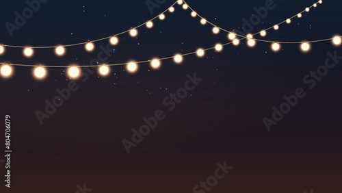 an outdoor garland with glow yellow lamps