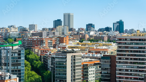Cityscape of the city of Madrid in a drone view with residential and office buildings, Spain. photo