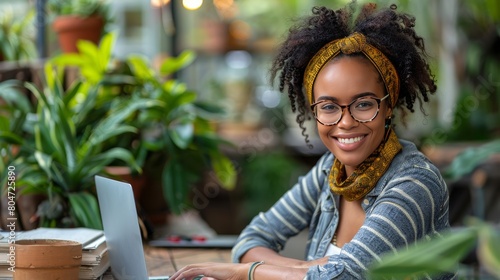 Woman Sitting at Table With Laptop