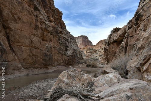 A River winds through a canyon. 