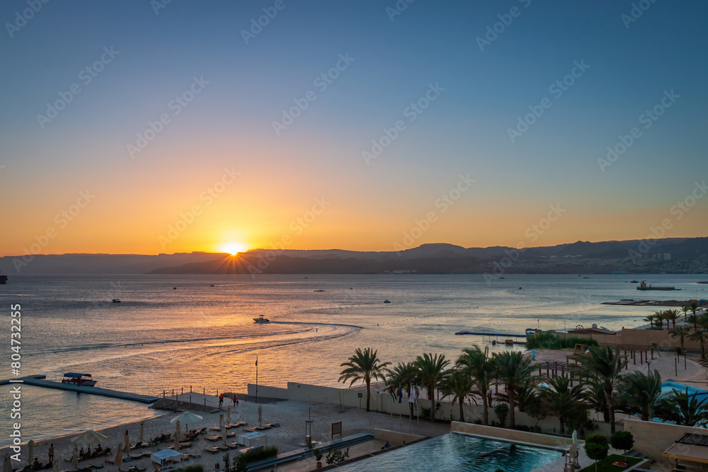 Scenic view of swimming pool and beach at Gulf of Aqaba in Aqaba, Jordan Scenic view of swimming pool and beach at Gulf of Aqaba in Aqaba, Jordan