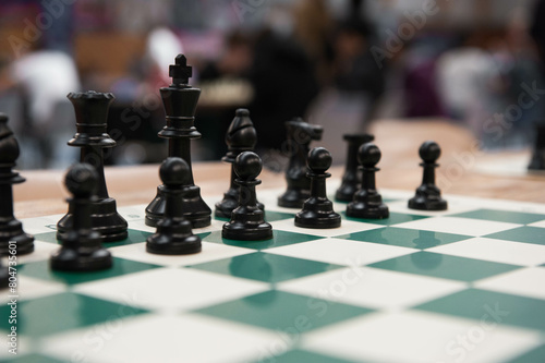 Black chess pieces on the chess board