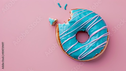 Stylish blue-iced doughnut with a bite taken, on a pink background. Simple and colorful design for food photography. Perfect for culinary blogs. AI photo