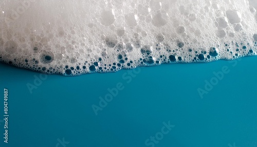 detergent foam bubble on blue background soap shower gel shampoo foam texture copy space generative ai © Dayami