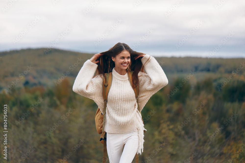 Hiker's Joy: A Smiling Woman on a Mountain Adventure Hiker's Joy: A Smiling Woman on a Mountain Adventure
