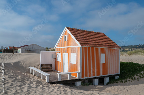 Orange wooden beach hut at the beach on the Atlantic coast in Portugal
