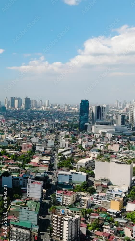 Makati City with skyscrapers and high rise towers. Metro Manila, Philippines. Vertical view. Makati City with skyscrapers and high rise towers. Metro Manila, Philippines. Vertical view.