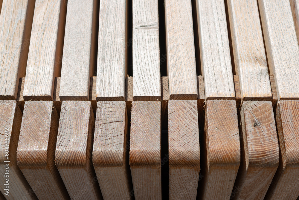close-up of wooden structure composed of various lengths of hardwood slats close-up of wooden structure composed of various lengths of hardwood slats