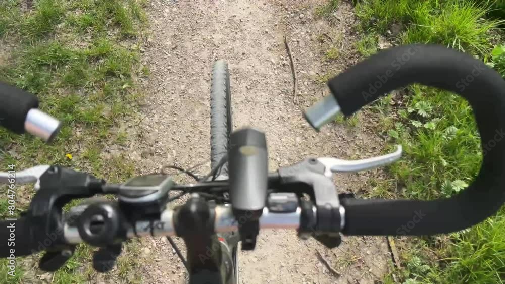 crossbike driving over rural gravel road viewing with handlebars crossbike driving over rural gravel road viewing with handlebars
