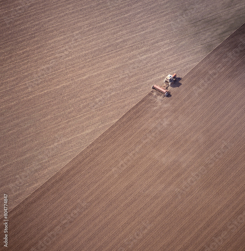  Aerial view of a tractor ploughing a paddock in western New South Wales,Australia.