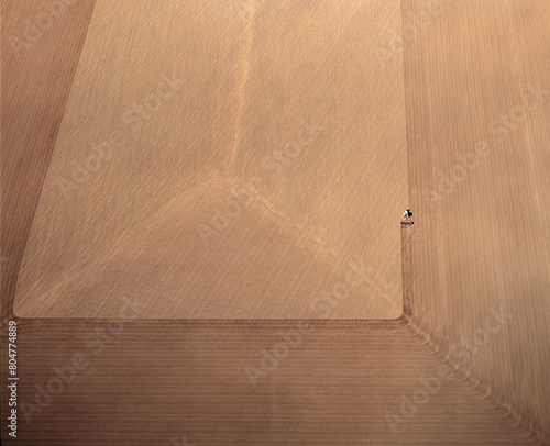  Aerial view of a tractor ploughing a paddock in western New South Wales,Australia..