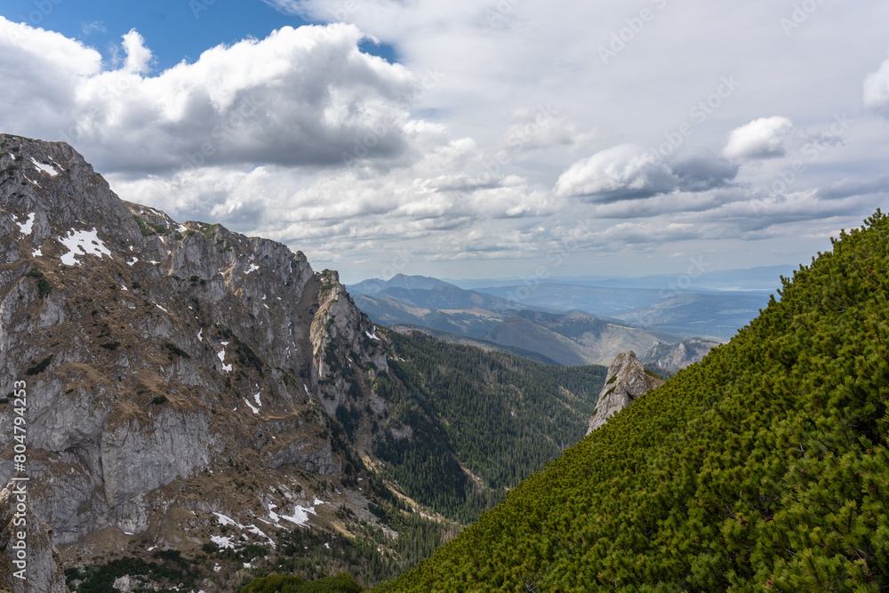 Fototapeta premium Clouds over the mountains, beautiful scenery of the mountains. 