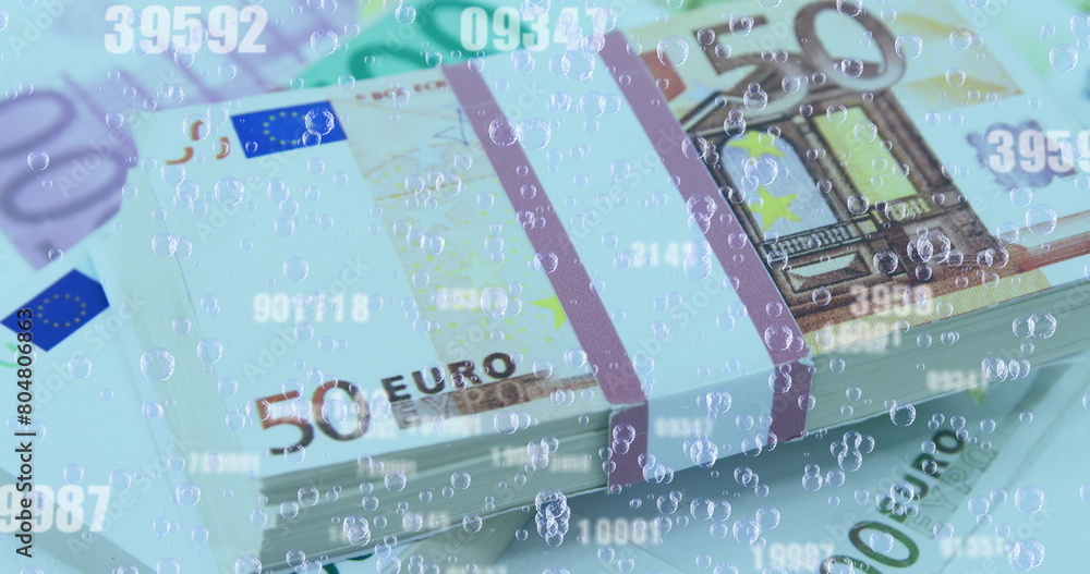 Fototapeta premium Image of numbers changing and bubbles over stacks of euro currency bills